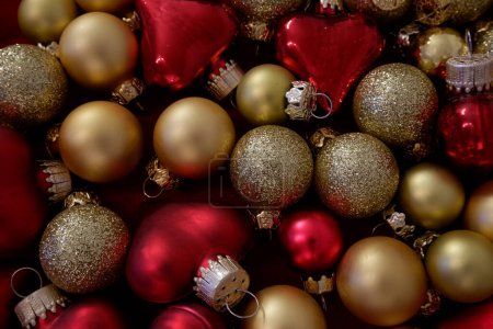 A variety of red and golden christmas tree baubles