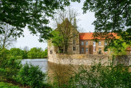 Historical moated castle and moat in Luedinghausen