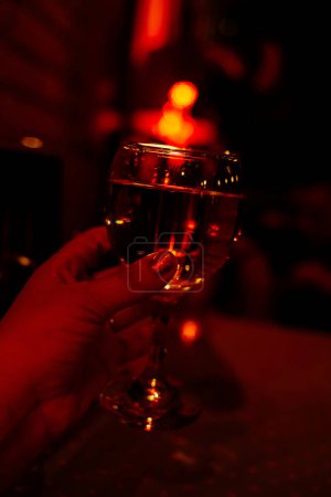 Photo for Glass of wine in hand. Party - Royalty Free Image