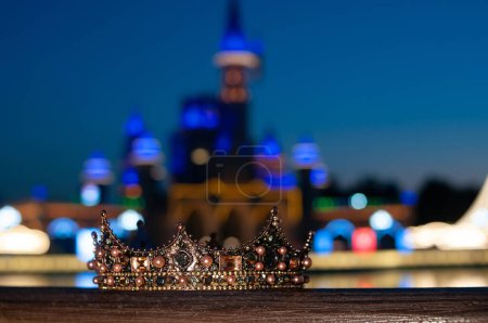 Photo for Royal luxury crown with red gemstones on castle background - Royalty Free Image
