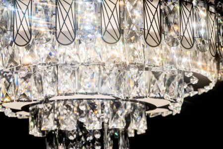 Chandelier, luxury close up crystals details on black background