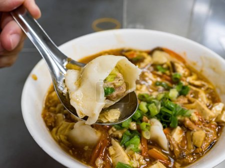 Photo for Dumplings in sour and spicy soup - Royalty Free Image