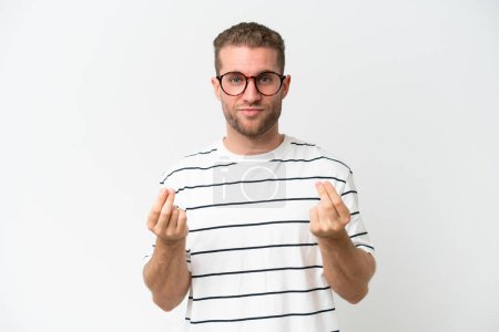 Photo for Young handsome caucasian man isolated on white background making money gesture but is ruined - Royalty Free Image