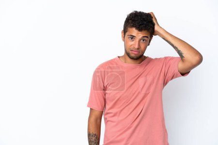 Photo for Young handsome Brazilian man isolated on white background with an expression of frustration and not understanding - Royalty Free Image