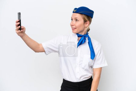 Photo for Airplane blonde stewardess woman isolated on white background making a selfie - Royalty Free Image