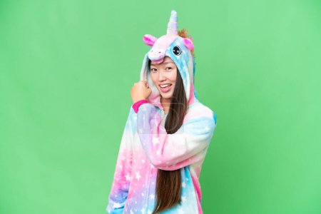 Photo for Young Asian woman with unicorn pajamas over isolated chroma key background celebrating a victory - Royalty Free Image