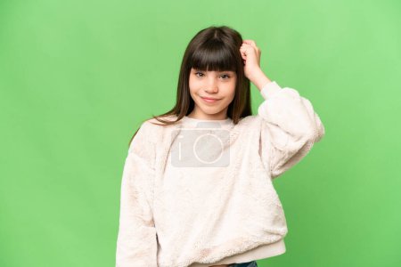 Photo for Little girl over isolated green chroma key background with an expression of frustration and not understanding - Royalty Free Image