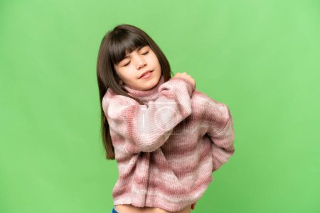 Photo for Little girl over isolated green chroma key background suffering from pain in shoulder for having made an effort - Royalty Free Image