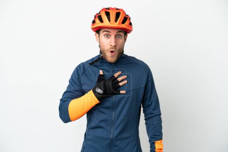 Photo for Young cyclist man isolated on white background surprised and shocked while looking right - Royalty Free Image