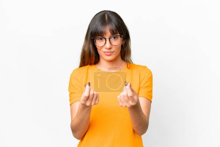 Téléchargez les photos : Young caucasian woman over isolated white background making money gesture but is ruined - en image libre de droit