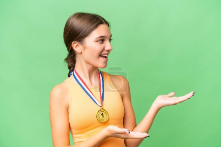 Photo for Teenager caucasian girl with medals over isolated background with surprise facial expression - Royalty Free Image
