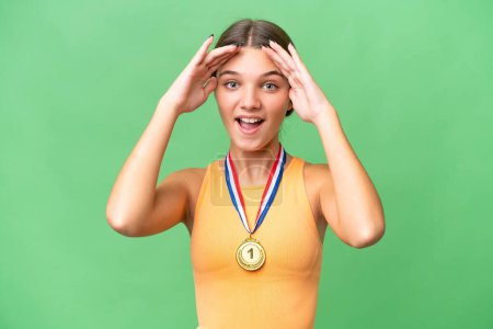 Photo for Teenager caucasian girl with medals over isolated background with surprise expression - Royalty Free Image