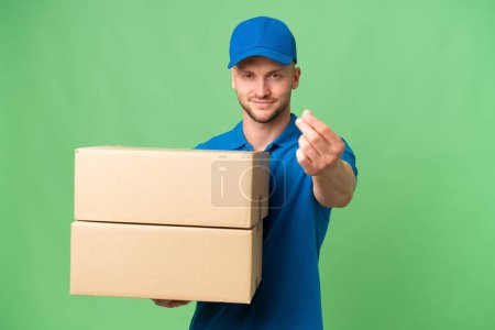 Delivery caucasian man over isolated background making money gesture
