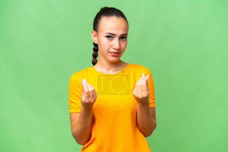 Photo for Young Arab woman over isolated background making money gesture but is ruined - Royalty Free Image