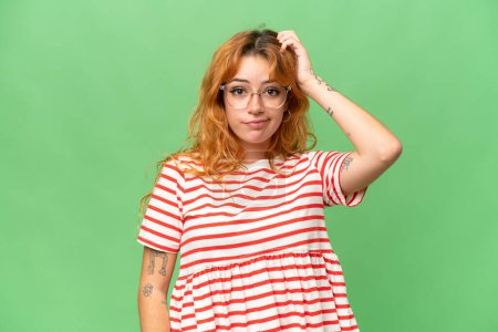 Photo for Young caucasian woman isolated on green screen chroma key background with an expression of frustration and not understanding - Royalty Free Image