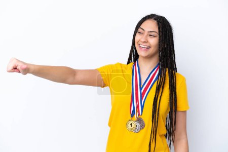 Photo for Teenager girl with braids and medals over isolated pink background giving a thumbs up gesture - Royalty Free Image