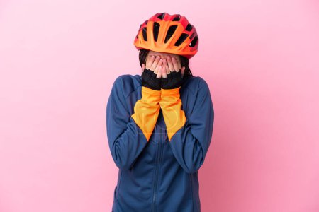Photo for Teenager cyclist girl isolated on pink background with tired and sick expression - Royalty Free Image