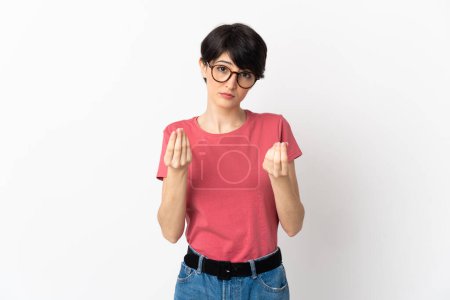 Photo for Woman with short hair isolated on white background making money gesture but is ruined - Royalty Free Image