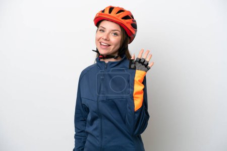 Photo for Young cyclist Lithuanian woman isolated on white background saluting with hand with happy expression - Royalty Free Image