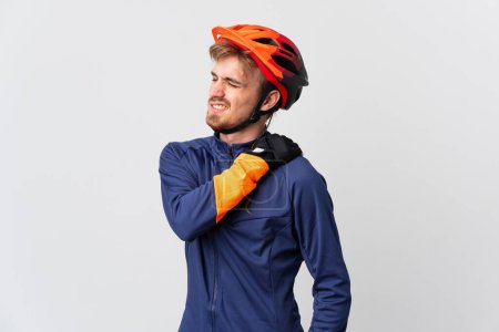Photo for Young cyclist blonde man isolated on white background suffering from pain in shoulder for having made an effort - Royalty Free Image