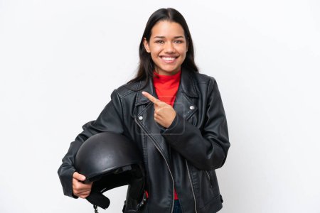 Photo for Young pretty woman holding a motorcycle helmet on white background - Royalty Free Image