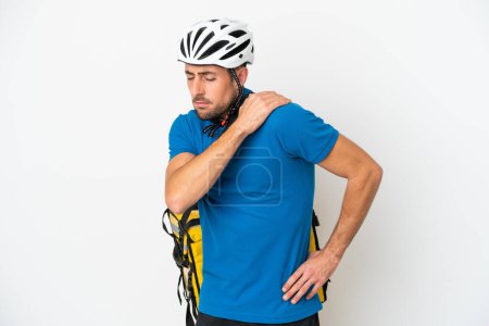 Photo for Young caucasian man with thermal backpack isolated on white background suffering from pain in shoulder for having made an effort - Royalty Free Image