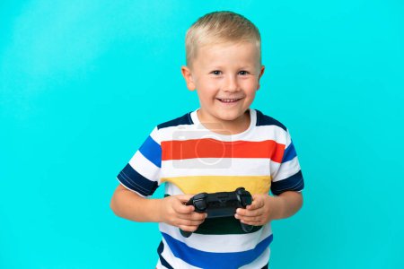 Photo for Little Russian boy playing with a video game controller over isolated background - Royalty Free Image