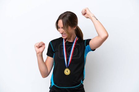Photo for Young caucasian woman with medals isolated on white background celebrating a victory - Royalty Free Image