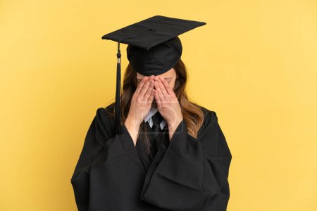 Photo for Young university graduate isolated on yellow background with tired and sick expression - Royalty Free Image