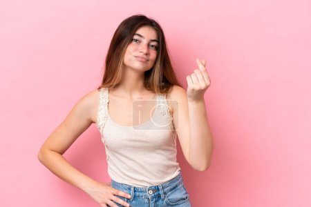 Photo for Young caucasian woman isolated on pink background making Italian gesture - Royalty Free Image