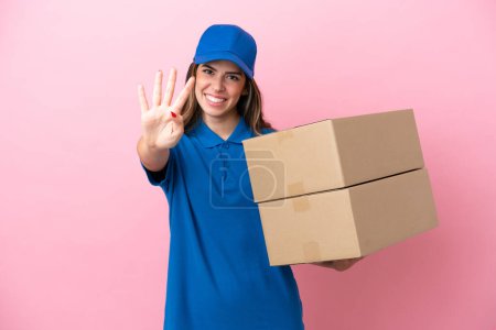 Photo for Delivery Italian woman isolated on pink background happy and counting four with fingers - Royalty Free Image