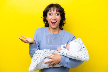 Photo for Young Argentinian woman with her cute baby with shocked facial expression - Royalty Free Image