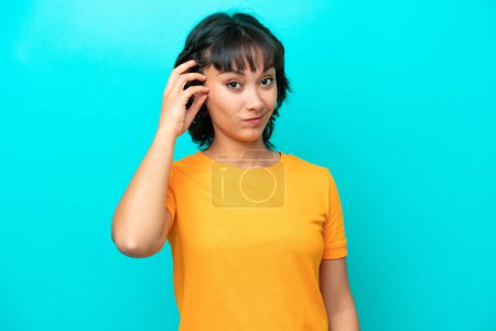 Photo for Young Argentinian woman isolated on blue background with an expression of frustration and not understanding - Royalty Free Image