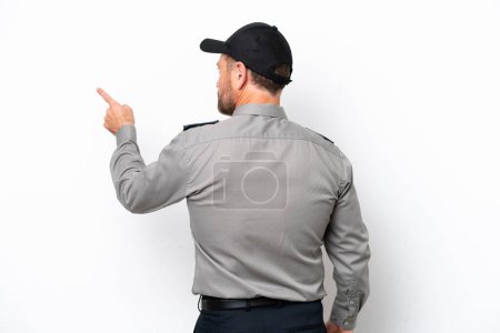 Photo for Middle age security man isolated on white background pointing back with the index finger - Royalty Free Image