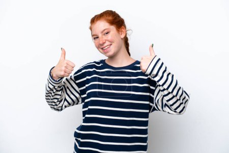 Téléchargez les photos : Young reddish woman isolated on white background giving a thumbs up gesture - en image libre de droit