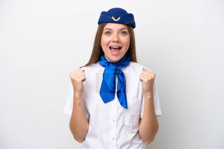 Photo for Airplane Lithuanian woman stewardess isolated on white background celebrating a victory in winner position - Royalty Free Image