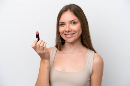 Téléchargez les photos : Young Lithuanian woman isolated on white background holding red lipstick - en image libre de droit