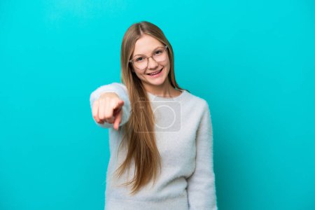 Photo for Young Russian woman isolated on blue background pointing front with happy expression - Royalty Free Image
