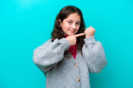 Photo for Little girl isolated on blue background making the gesture of being late - Royalty Free Image