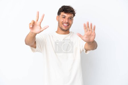 Photo for Young caucasian handsome man isolated on white background counting eight with fingers - Royalty Free Image
