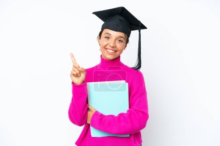 Photo for Young student hispanic woman holding a books isolated on white background showing and lifting a finger in sign of the best - Royalty Free Image