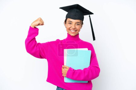 Photo for Young student hispanic woman holding a books isolated on white background doing strong gesture - Royalty Free Image