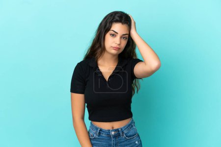 Photo for Young caucasian woman isolated on blue background with an expression of frustration and not understanding - Royalty Free Image