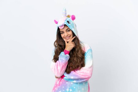 Photo for Young caucasian woman wearing a unicorn pajama isolated on white background smiling - Royalty Free Image