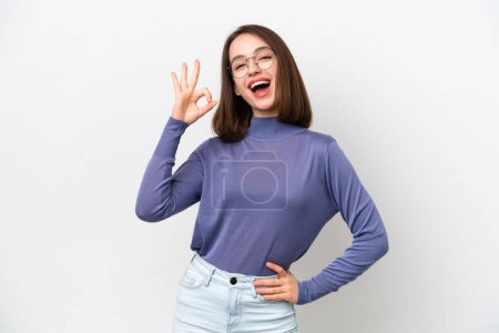 Photo for Young Ukrainian woman isolated on white background showing ok sign with fingers - Royalty Free Image