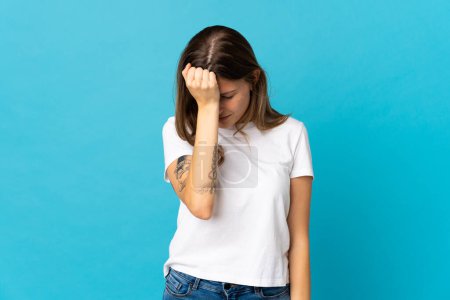 Photo for Young slovak woman isolated on blue background with headache - Royalty Free Image
