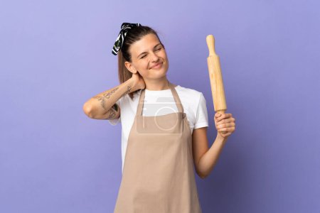 Photo for Cooker Slovak woman isolated on purple background with neckache - Royalty Free Image