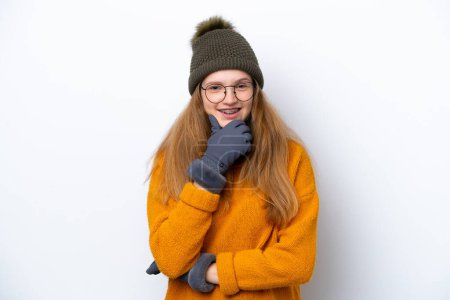 Photo for Teenager Russian girl wearing winter jacket isolated on white background with glasses and smiling - Royalty Free Image