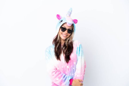 Photo for Young Russian woman wearing a unicorn pajama isolated on white background with glasses and smiling - Royalty Free Image