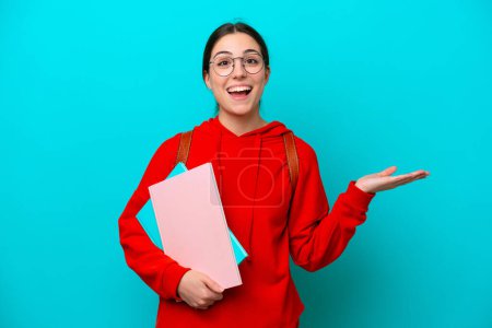 Photo for Young student caucasian woman isolated on blue background with shocked facial expression - Royalty Free Image